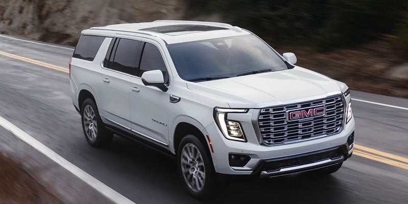 white 2026 GMC Yukon in motion
